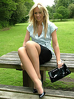 Hot blonde MILF shows her shiny black heels and pantyhose in her cheeky short office skirt
