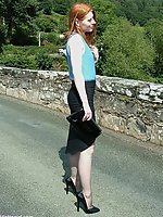 Cute redhead MILF flashing her shiny stilettos and pantyhose