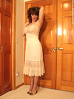 Hot mature tease in her lacy slip, sheer stockings high heels and no panties